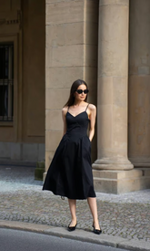 a lady in a black dress
